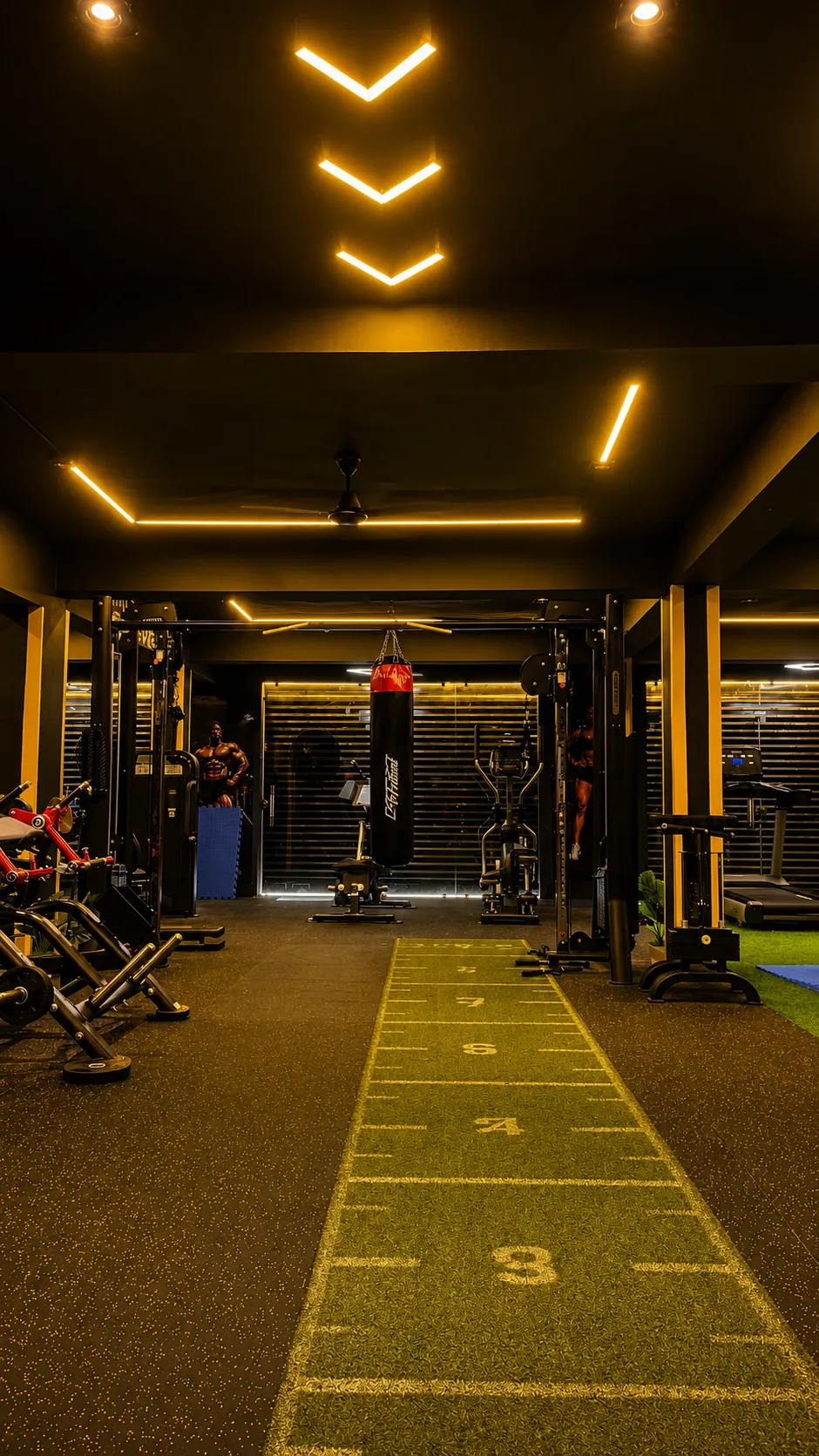 Punching bag and strength machines in the boxing corner